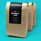 3 bags of Rumble Jar coarse ground coffee for cold brew - blue background