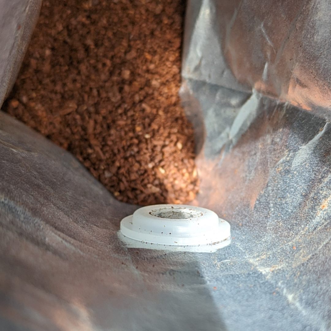 interior of coffee bag features durable foil lining and a one-way degassing valve to ensure freshness