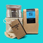 Rumble Jar 32oz brewing kit with bag of whole beans - blue background 